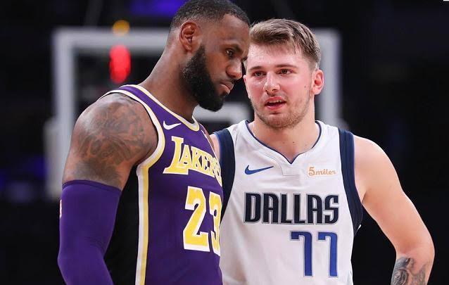  东契奇40+三双独行侠险胜热火  